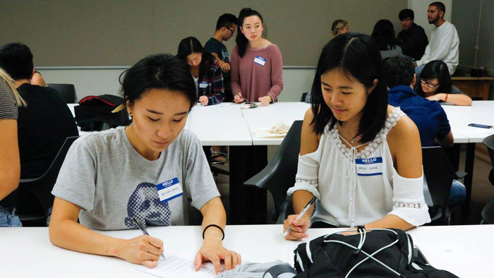 Two students using goal-building worksheets